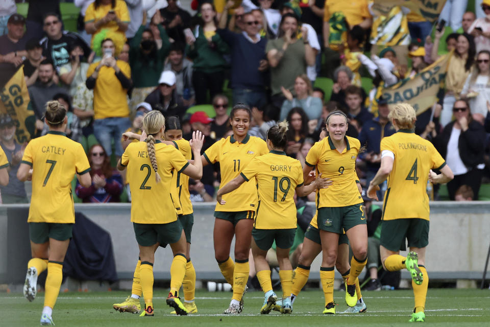 Australia's Mary Fowler, center, celebrates with teammates after scoring against Sweden during their women's friendly soccer match in Melbourne, Australia, Saturday, Nov. 12, 2022. (Asanka Brendon Ratnayake)