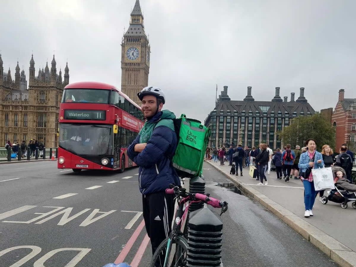 Shaf lets Barney Davis try on the delivery bag (Shaf Hussain)