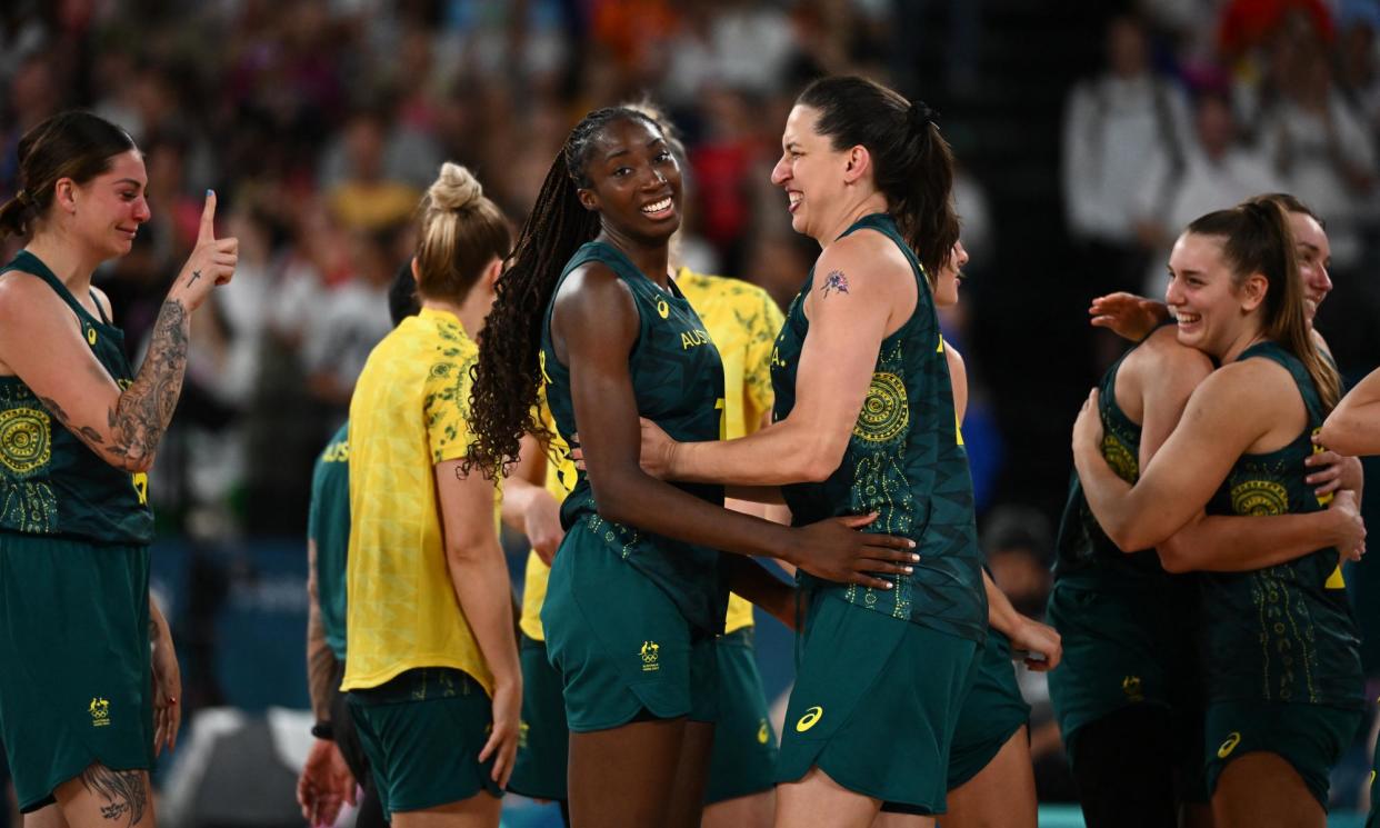 <span>Marianna Tolo hugs Ezi Magbegor after Australia won the women's bronze medal basketball match against Belgium at Bercy Arena in Paris.</span><span>Photograph: Aris Messinis/AFP/Getty Images</span>