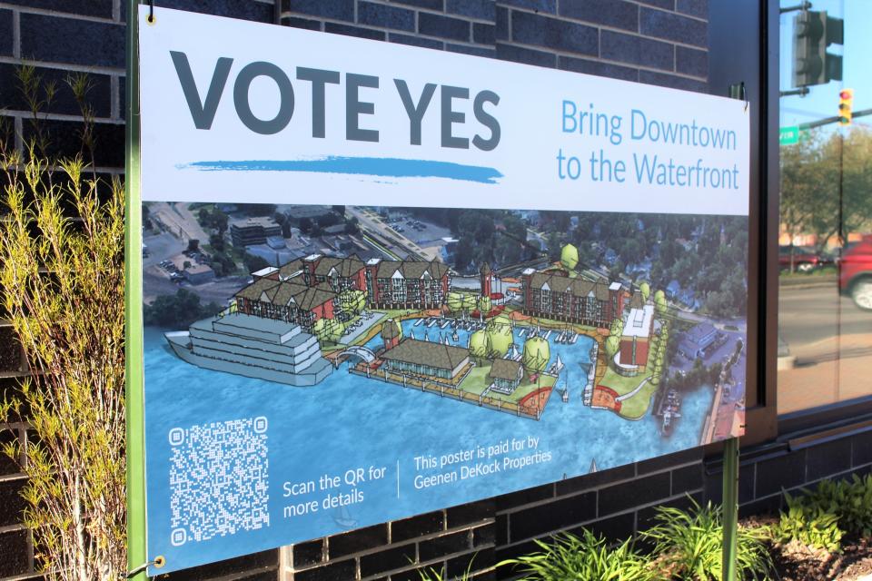 A sign along Ninth Street in downtown Holland urges people to "vote yes" on the May 2 ballot proposal.