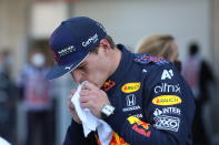 Red Bull driver Max Verstappen, of The Netherlands, wipes his mouth after coming in third in the qualifying run of the Formula One Mexico Grand Prix auto race at the Hermanos Rodriguez racetrack in Mexico City, Saturday, Nov. 6, 2021. (Edgard Garrido, Pool Photo via AP)