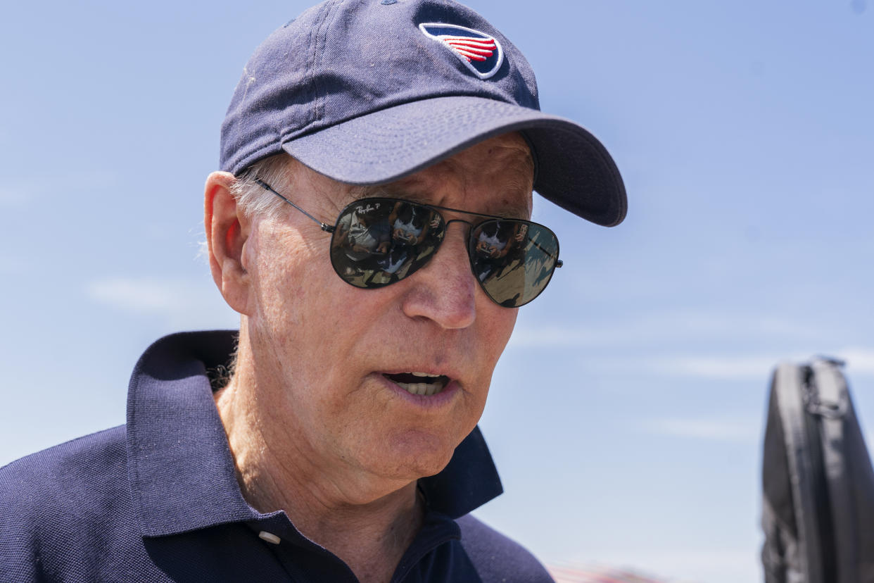 President Joe Biden stops and speaks to members of the media as he walks on the beach with his granddaughter Natalie Biden and daughter Ashley Biden, in Rehoboth Beach, Del., Monday, June 20, 2022. (AP Photo/Manuel Balce Ceneta)