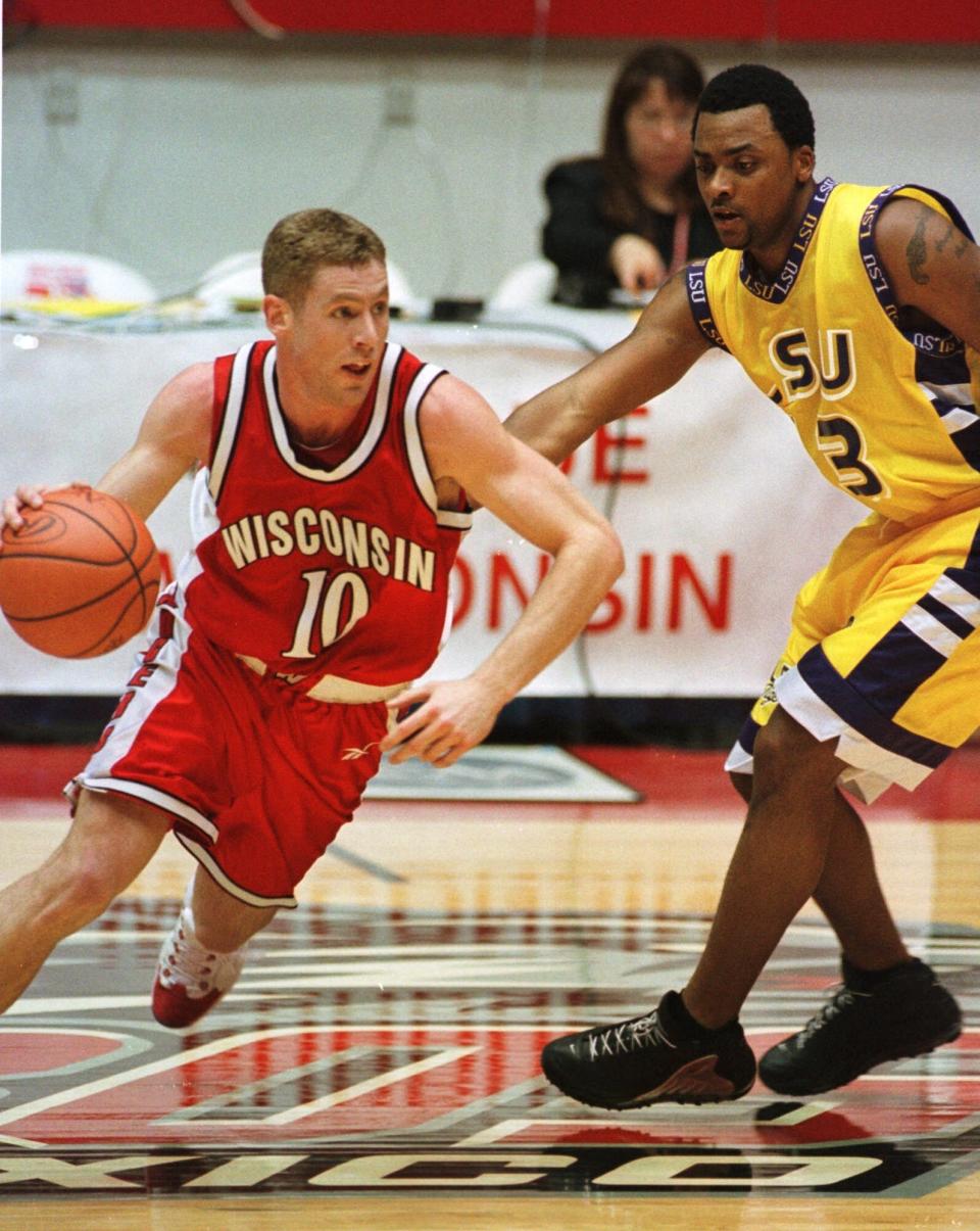 Wisconsin's Jon Bryant (10) drives around LSU's Torris Bright during the second half Thursday, March 23, 2000, of the NCAA West Regional in Albuquerque, N.M. Bryant led Wisconsin with 16 points in their 61-48 victory.