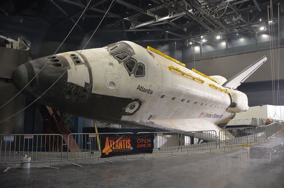 Space shuttle Atlantis is seen fully-exposed, its protective shrink-wrap cover removed, at NASA's Kennedy Space Center Visitor Complex in Florida, April 26, 2013.