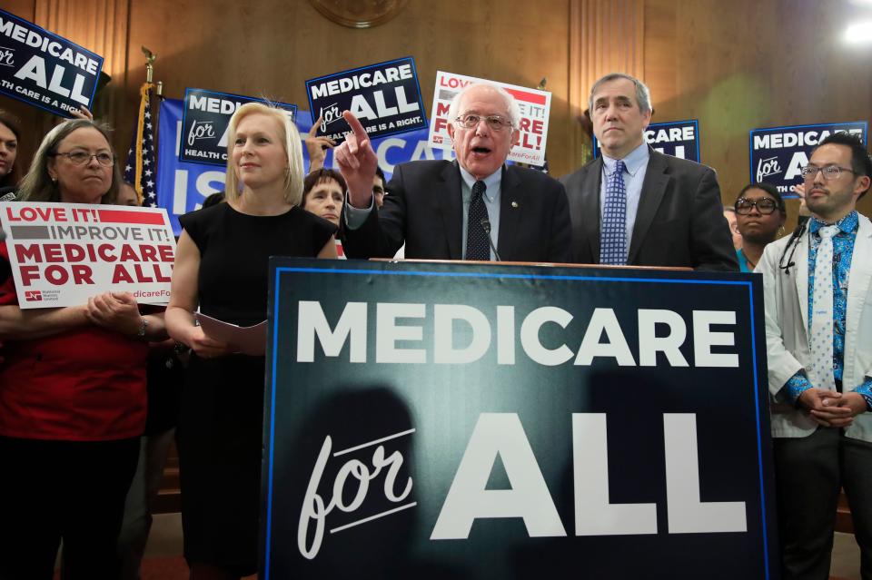 Sen. Bernie Sanders, flanked by Sens.. Kirsten Gillibrand and Jeff Merkley, D- introduce the Medicare for All Act of 2019 in Washington on April 10, 2019.