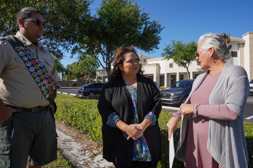 From left: Jonathan Rodriguez, his mother Maria Rodriguez and Amanda Townsend, director of Collier County Museums speak while at Plot N of the Rosemary Cemetery in Naples.
