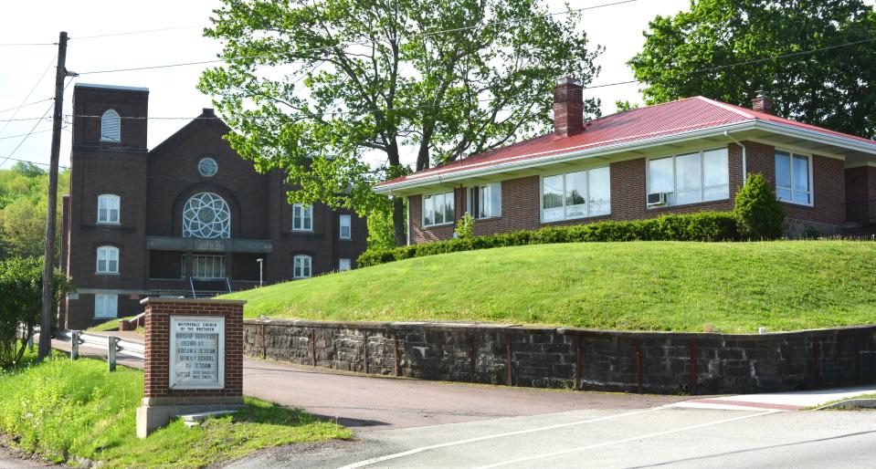 The Meyersdale Church of the Brethren and its parsonage sit along Beachley Street, overlooking Monument Square in Meyersdale.