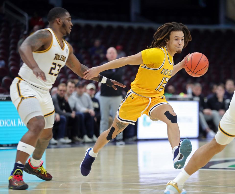 Kent State guard Jalen Sullinger drives against Toledo guard Tyler Cochran during the first half in a Mid-American Conference Tournament quarterfinal, Thursday, March 14, 2024, in Cleveland.