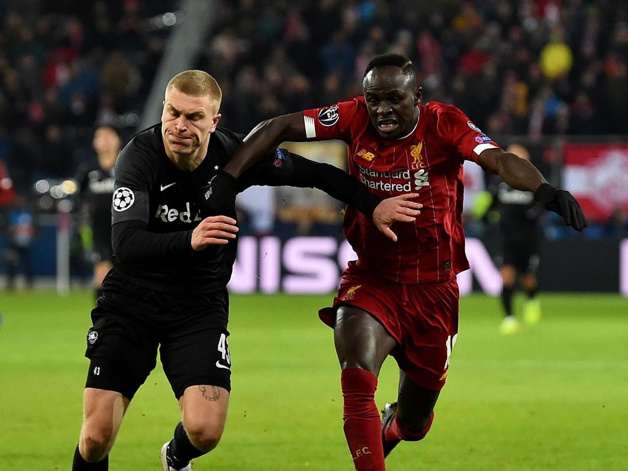 Sadio Mane of Liverpool with Rasmus Kristensen of RB Salzburg: Liverpool FC via Getty Images