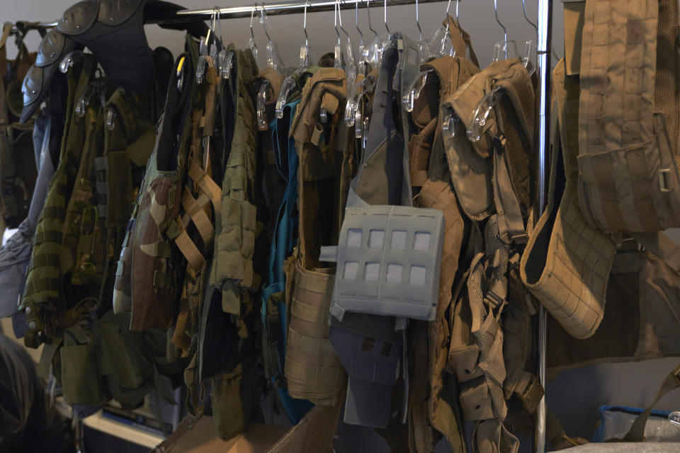 Bulletproof vests for the video game series Call of Duty hang in a prop closet on Friday, Oct. 21, 2022, at Activision Blizzard, Infinity Ward Division, in Woodland Hills, Calif. Call of Duty has been one of the best-selling video games for the past decade-plus, and is at the heart of the developing antitrust fight over whether Microsoft will be able to acquire Activision Blizzard. (AP Photo/Allison Dinner)