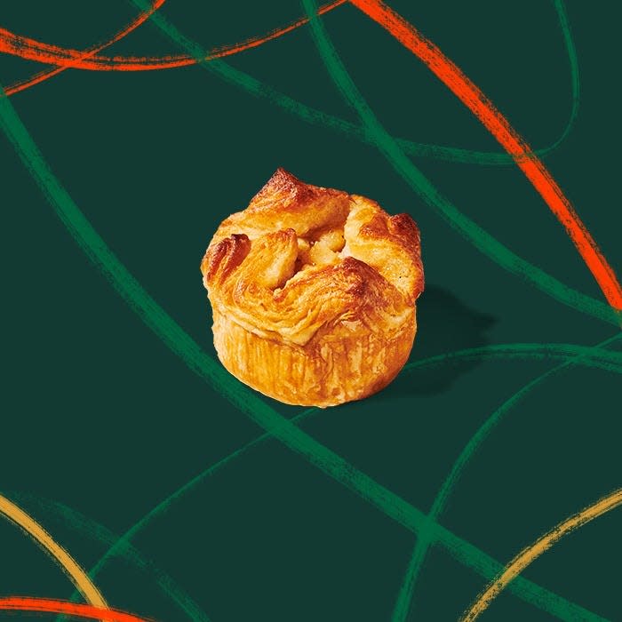 Starbucks Baked Apple Croissant is new to the fall 2023 menu. The bakery item is made with croissant dough with a warm apple filling and topped with sugar.