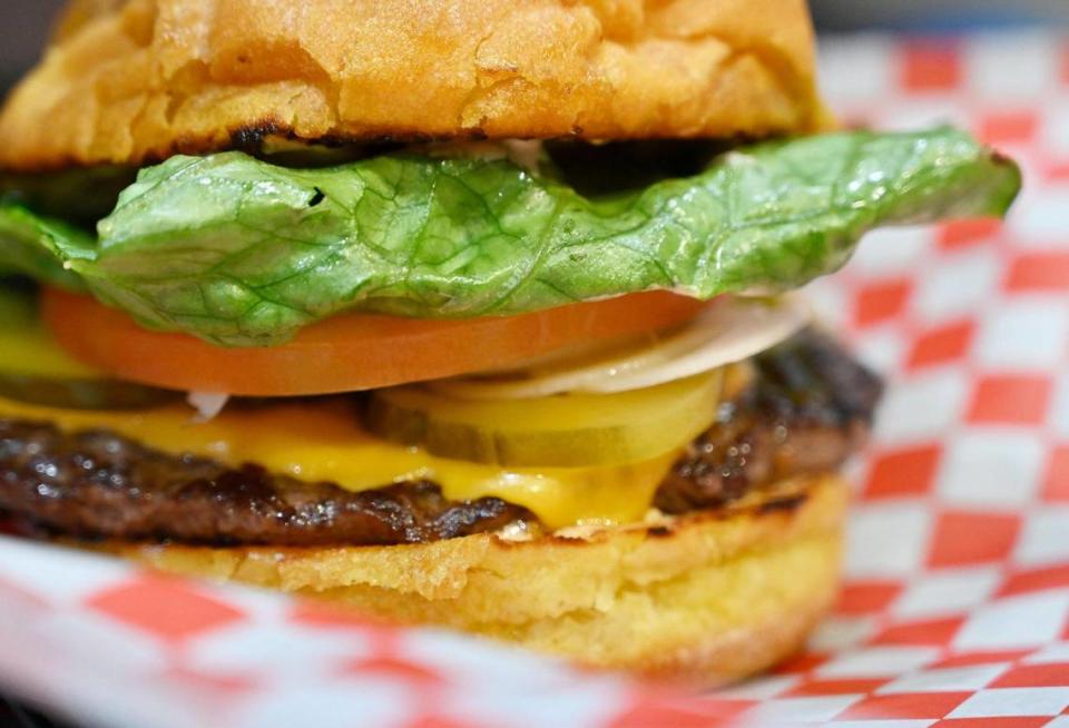 A classic burger with cheese featuring buttery toasted potato buns, from Buttery Buns, a new eatery just south of Fresno at Highway 99 and North Avenue. Photographed Wednesday, June 21, 2023.