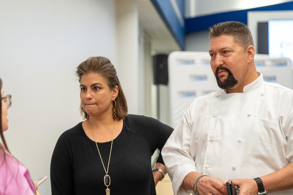 Justin Kell, executive chef of Beauty & the Bistro, right, and Michelle Roddel, owner of the catering business, appear at an event where Beauty & the Bistro and four other small businesses were awarded grants from the "Doing Business with Giants" program, a partnership between Texas A&M University-Corpus Christi and Cheniere Energy, at the Coastal Bend Business Innovation Center on Tuesday, March 28, 2023.