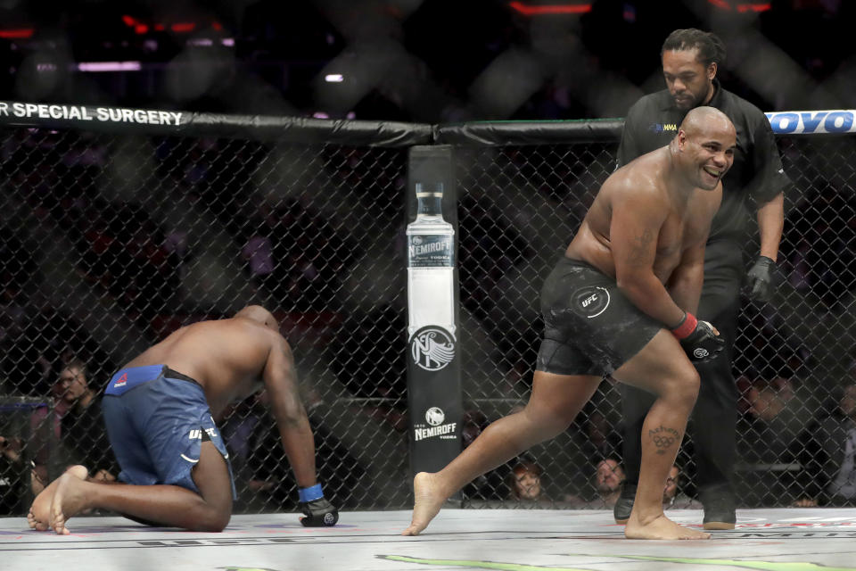 Daniel Cormier, right, reacts after defeating Derrick Lewis by submission during the second round of a heavyweight mixed martial arts bout at UFC 230, early Sunday, Nov. 4, 2018, at Madison Square Garden in New York. (AP Photo/Julio Cortez)