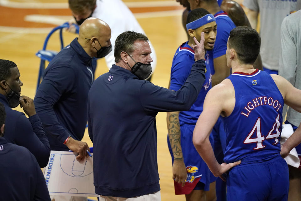 Kansas head coach Bill Self, center, has his team on a nice roll the past few weeks. (AP Photo/Eric Gay)