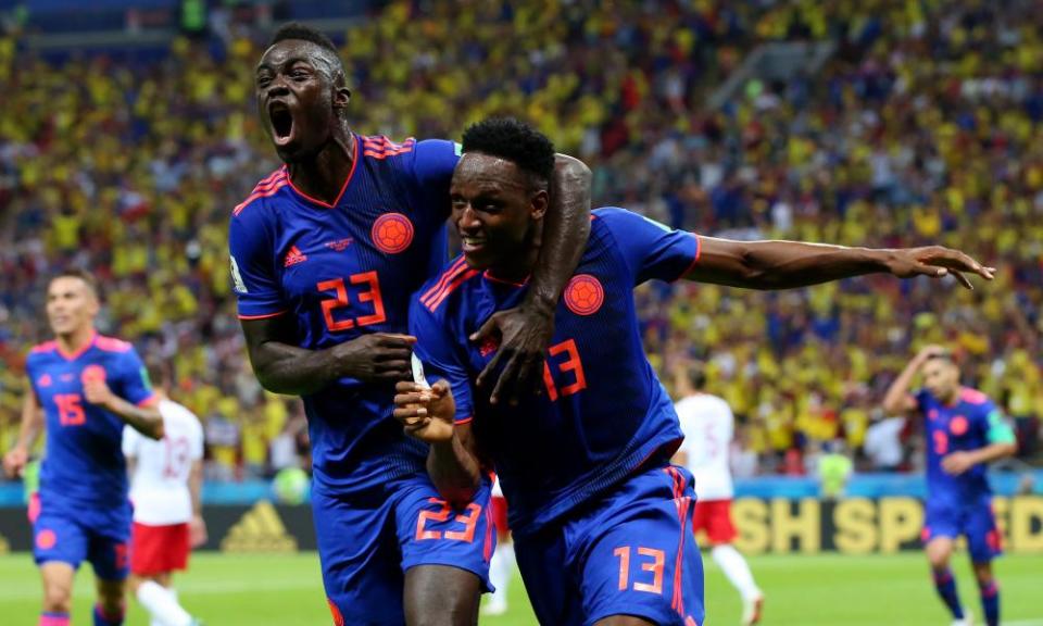 Yerry Mina celebrates with Davinson Sánchez after scoring Colombia’s first goal in their emphatic victory against Poland in Group H.