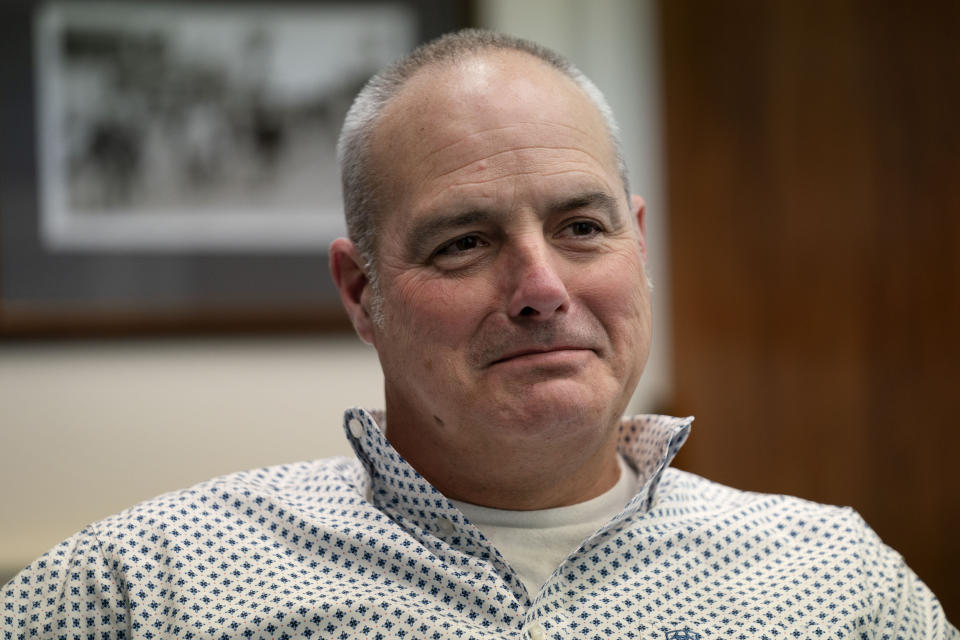 Charles F. Krugh, president of Bath Iron Works, listens during a meeting at his office at the shipyard, Tuesday, Dec. 20, 2022, in Bath, Maine. The former Gulfstream Areospace executive and U.S. Army veteran oversees a workforce that builds destroyers for the Navy. (AP Photo/Robert F. Bukaty)