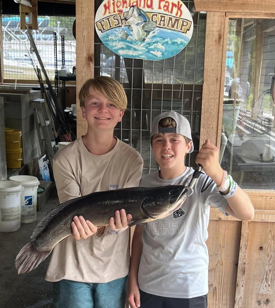 Kayden Rawlins (right) caught the winning mudfish in last weekend's Mr. Mud tournament at Highland Park in DeLand. It checked in at 8.8 pounds, and Kayden and fishing partner Jackson Rickles split the $1,500 first prize.