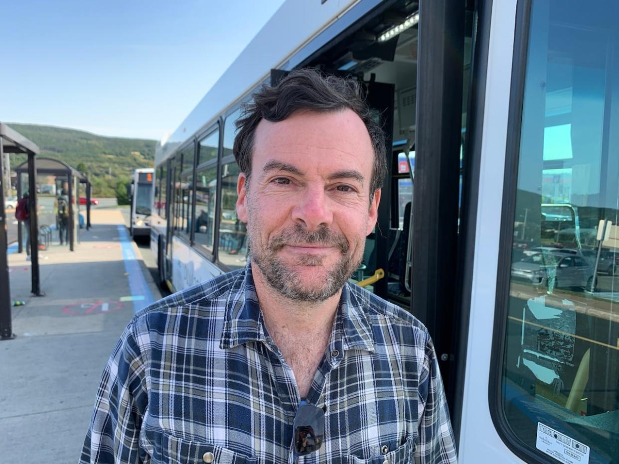 David Brake stands at a busy Metrobus transit hub in St. John's. Brake is the head of the Essential Transit Association. 