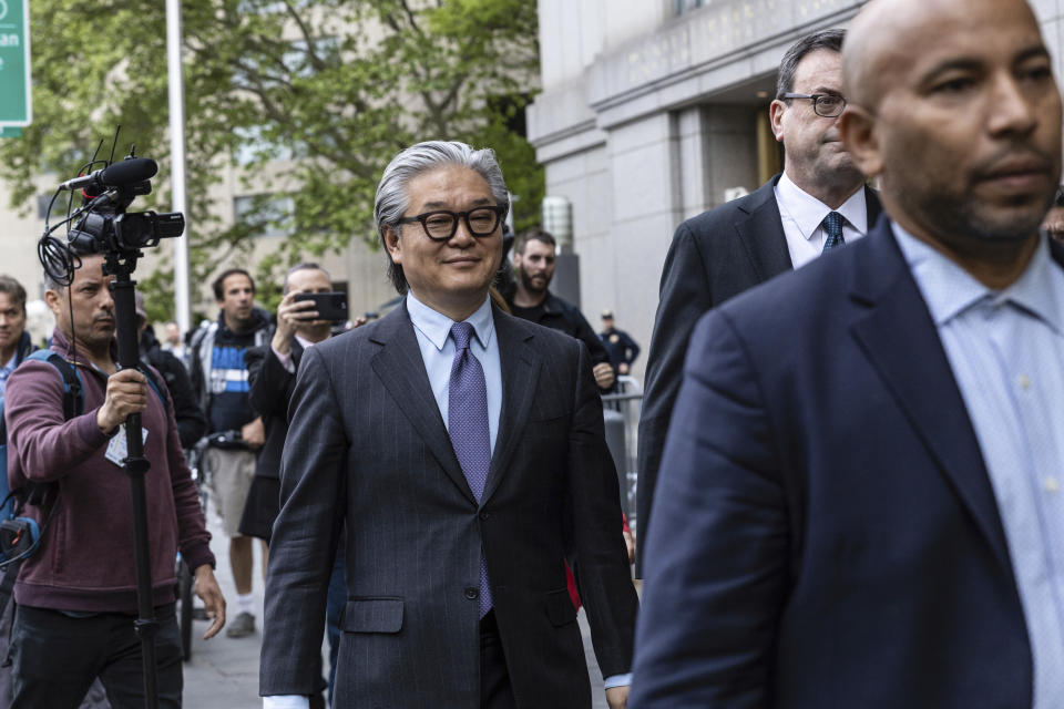 Bill Hwang, founder of Archegos Capital Management, center, leaves Manhattan federal court after the first day of his corruption trial, Monday, May, 13, 2024, in New York. (AP Photo/Stefan Jeremiah)