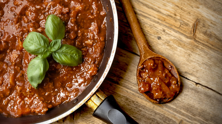 pot of bolognese with spoon