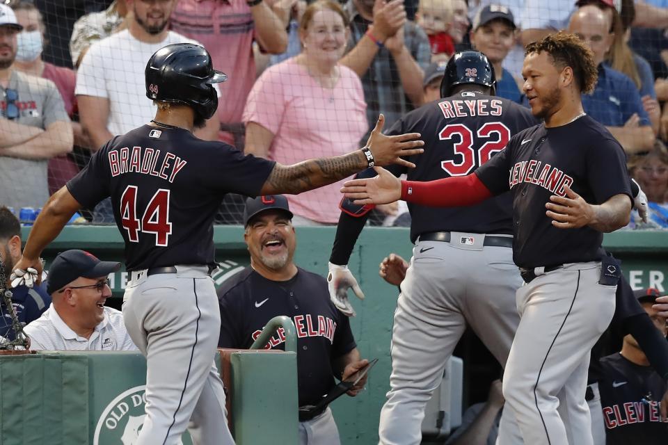 Cleveland Indians' Franmil Reyes (32) celebrates his two-run home run that also drove in Bobby Bradley (44) during the ninth inning of a baseball game against the Boston Red Sox, Saturday, Sept. 4, 2021, in Boston. (AP Photo/Michael Dwyer)
