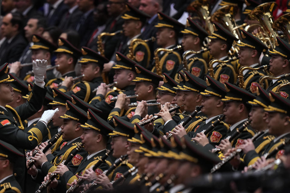 A conductor leads the military band as they perform a national anthem during the opening session of the National People's Congress (NPC) at the Great Hall of the People in Beijing, Tuesday, March 5, 2024. China on Tuesday announced a 7.2% increase in its defense budget, which is already the world's second-highest behind the United States at 1.6 trillion yuan ($222 billion), roughly mirroring the rise of the last year. (AP Photo/Andy Wong)
