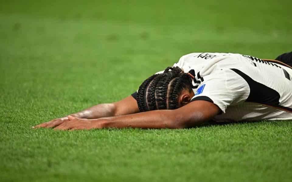 Gnabry lies face down - Stuart Franklin/Getty Images