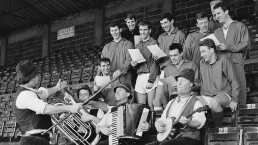 Bristol City FC players rehearsing club song with singer Adge Cutler 