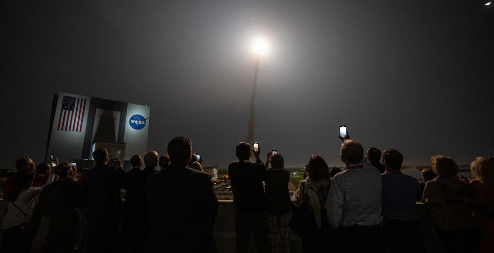 Spaceport managers and guests take in the Artemis 1 launch from a balcony 4.2 miles from pad 39B. The sky-lighting liftoff was accompanied by a thundering roar and a ground-shaking shockwave reminiscent of space shuttle launchings. / Credit: NASA