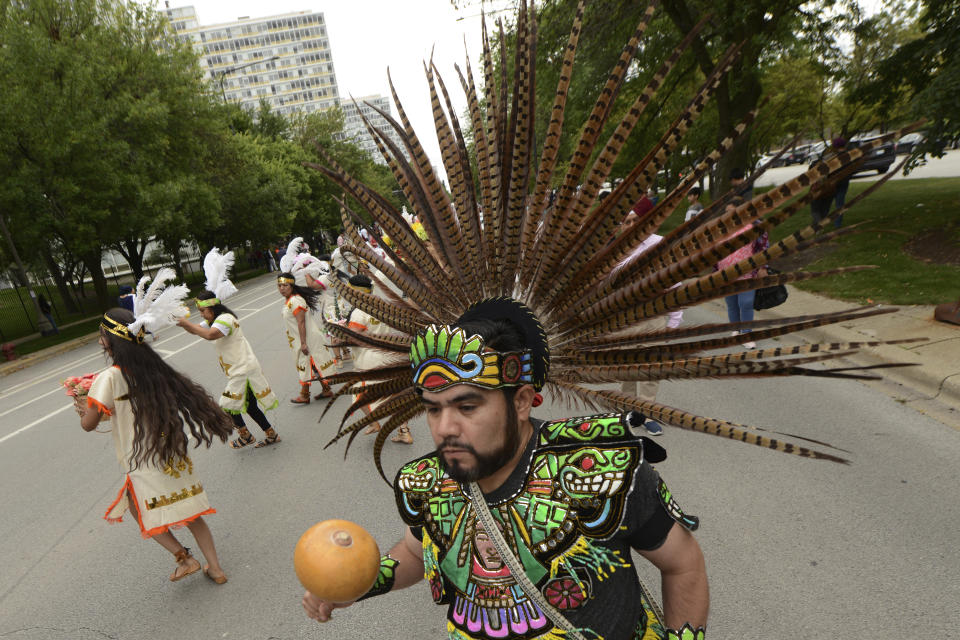 Members of the Cristo Rey Parish perform during the Parliament of World Religion Parade of Faiths, Sunday, Aug. 13, 2023, in Chicago. (AP Photo/Paul Beaty)