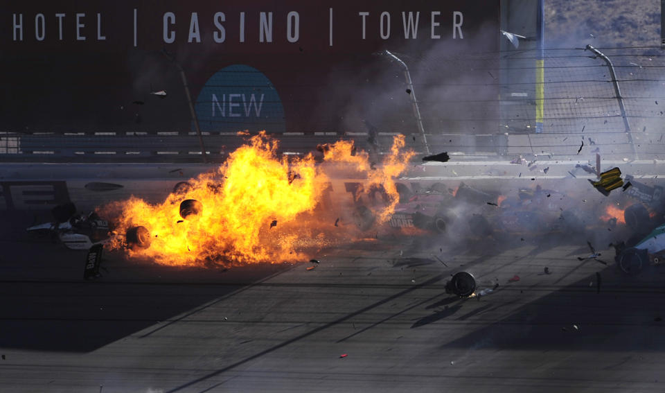 LAS VEGAS - OCTOBER 16: The car of Dan Wheldon driver of the #77 Bowers & Wilkins Sam Schmidt Motorsports Dallara Honda (top left) bursts into flames in a 15 car pile up during the Las Vegas Indy 300 part of the IZOD IndyCar World Championships presented by Honda on October 16, 2011 at the Las Vegas Motor Speedway in Las Vegas, Nevada. (Photo by Robert Laberge/Getty Images)