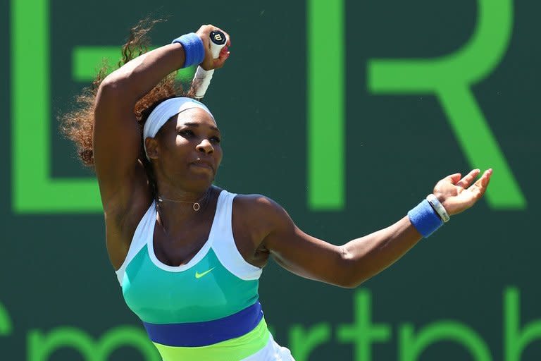 Serena Williams returns a shot to Maria Sharapova in the Miami Masters on March 30, 2013. Williams battled back to capture the final 10 games on her way to a 4-6, 6-3, 6-0 victory in Saturday's WTA Miami hardcourt final