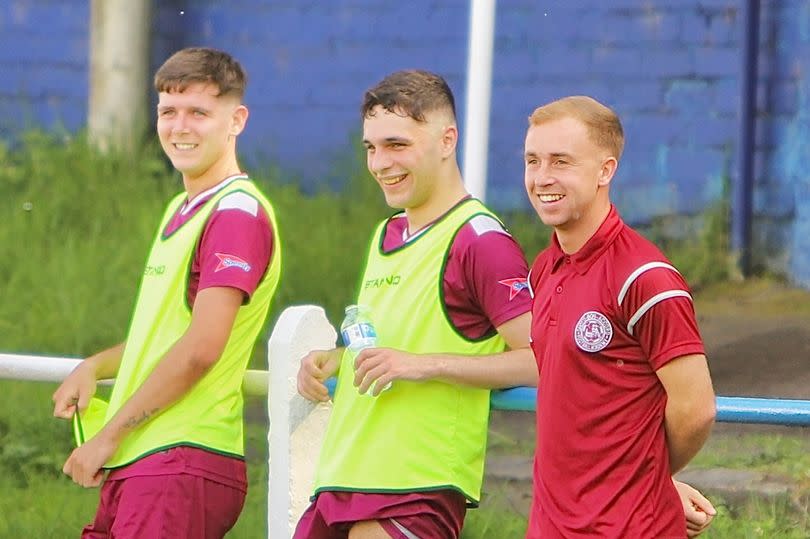 Ben Richford, Rico di Marco and Jack Gordon watched on from the sidelines as Shotts sealed promotion -Credit:Gavin Campbell
