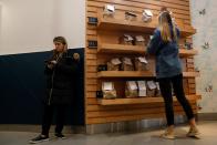 A customer picks up her order at a Chopt Creative Salad Co., location in New York