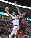 Washington Wizards' Jared Butler drives to the basket as Chicago Bulls' Dalen Terry defends during the first half of an NBA basketball game Monday, March 25, 2024, in Chicago. (AP Photo/Charles Rex Arbogast)