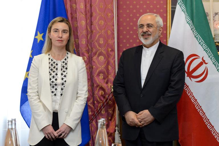 EU foreign policy chief Federica Mogherini (L) meets with Iranian Foreign Minister Mohammad Javad Zarif during nuclear talks in Lausanne on March 29, 2015