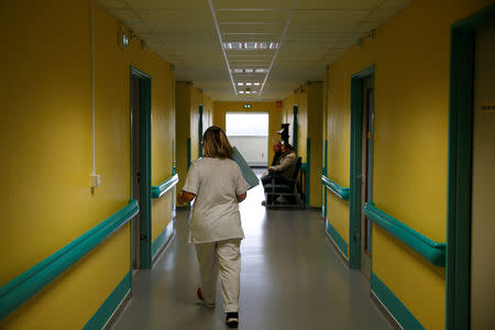 A nurse walks in a corridor at the hospital of Laval, France, November 8, 2018. Picture taken November 8, 2018. REUTERS/Stephane Mahe