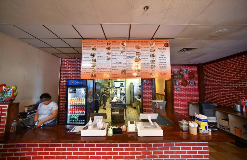 The customer counter and menu board at Taco Chon is pictured Tuesday, Dec. 28, 2021, in St. Cloud.