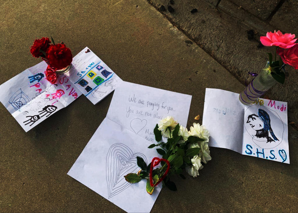 Flowers and notes have been left outside Saugus High School in Santa Clarita, Calif., late Thursday afternoon, Nov. 1, 2019, after a shooting incident there that morning. Authorities said a 16-year-old student shot five students, then himself. (AP Photo/Natalie Rice)