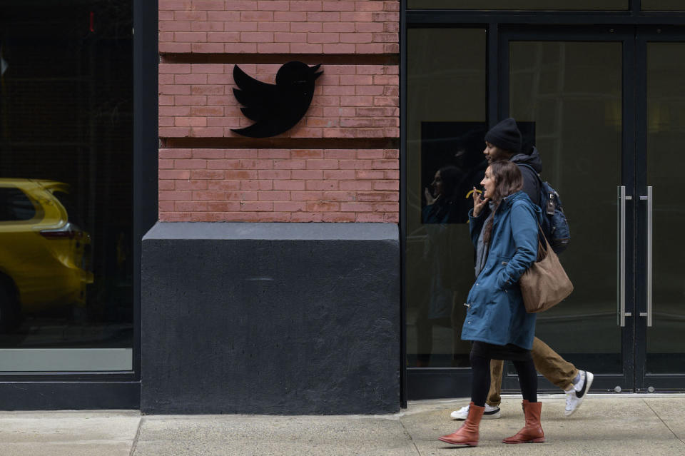 People walk past the Twitter offices in New York City on January 12, 2023. (Photo by ANGELA WEISS / AFP) (Photo by ANGELA WEISS/AFP via Getty Images)