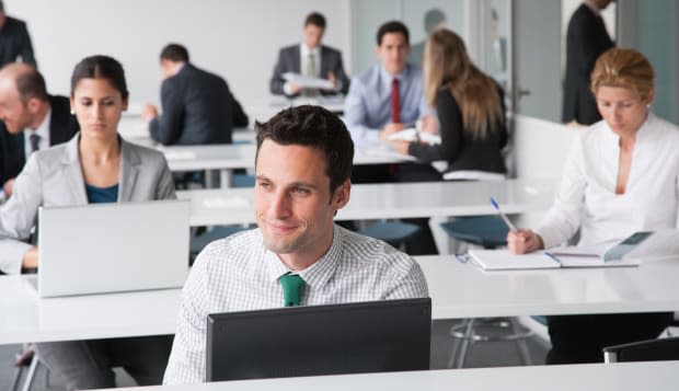 Businesspeople working in corporate training facility