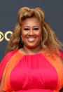 <p>Comedian Ashley Nicole Black's multidimensional kinky blonde hair gave a new meaning to the half up-half down style. For makeup, she opted for bold, fluttery lashes and soft pink eyeshadow to match her colorblock gown. </p>