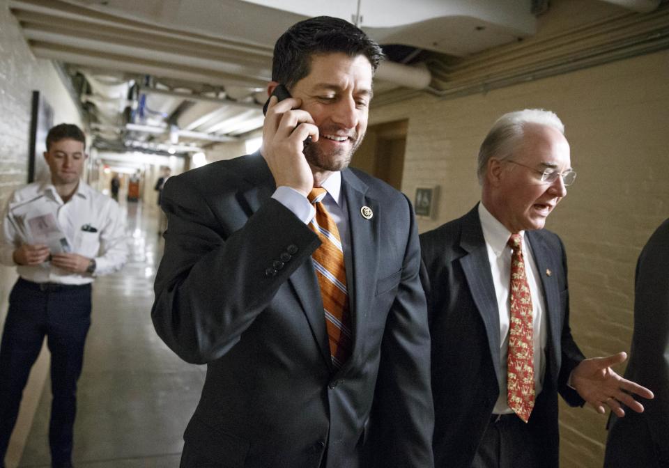 FILE - In this Jan. 13, 2015 file photo, House Ways and Means Committee Chairman Rep. Paul Ryan, R-Wis., left, joined by Rep. Tom Price, R-Ga., heads to a meeting of House Republicans on Capitol Hill in Washington. When President-elect Donald Trump takes office in January, Republicans will have the opportunity to do something they have desired for years - overhaul Medicaid, the program that provides health care to millions of lower-income and disabled Americans. Republicans have argued that states have little incentive to keep expenses under control, because no state pays more than half the total cost. Both Ryan and Trump’s pick for secretary of health and human services, Price, want to switch to block grants. (AP Photo/J. Scott Applewhite, File)