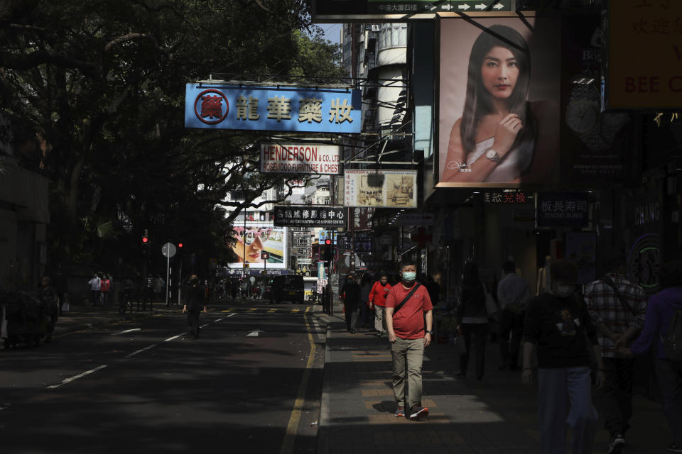 A man wears face mask to protect himself from possibly contracting the coronavirus COVID-19, in Hong Kong, Wednesday, April 15, 2020. (AP Photo/Kin Cheung)