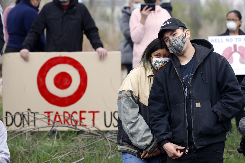 People take part in a rally on Sunday, April 11, 2021 organized by the Little Village Environmental Justice Organization honoring the community members who have lost their lives to environmental racism, in particular to last year's botched smokestack implosion in the Little Village area. (AP Photo/Shafkat Anowar)