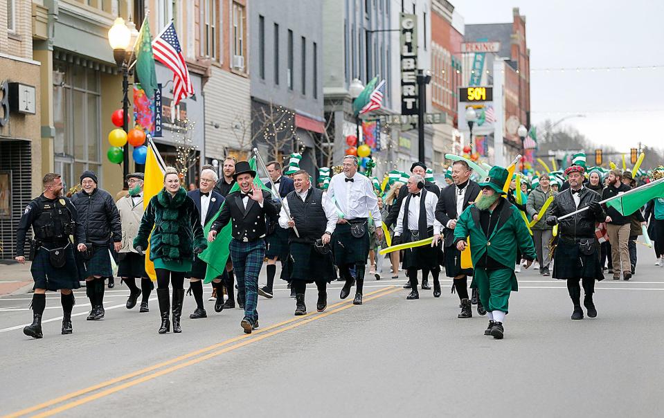 A kilt brigade makes its way down Main Street Friday as part of Ashland's St. Patrick's Day parade.