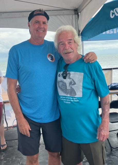 Contest host Phil Salick, right, is joined by longtime announcer Greg "G.T." Taylor in the booth during Monday's finals of the 38th Rich Salick National Kidney Foundation Surf Festival on Cocoa Beach.