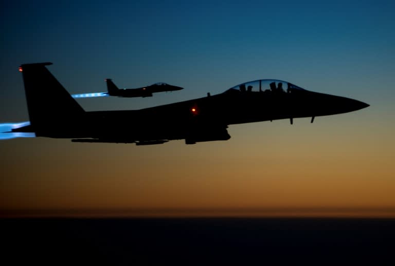 A pair of US F-15E aircraft fly over Iraq after conducting air strikes in Syria in 2014, shown in this US Air Force picture