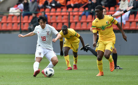 Soccer Football - International Friendly - Kirin Challenge Cup 2018 - Japan vs Mali - Stadium Maurice Dufrasne, Liege, Belgium - March 23, 2018 Japan’s Shoya Nakajima shoots at goal REUTERS/Eric Vidal